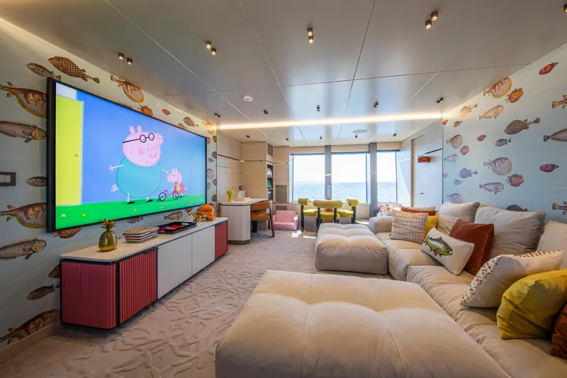 Oscar Yacht Photos Pics Luxurious 2023 Numarine 37XP yacht interior with plush seating, large TV, and ocean view.