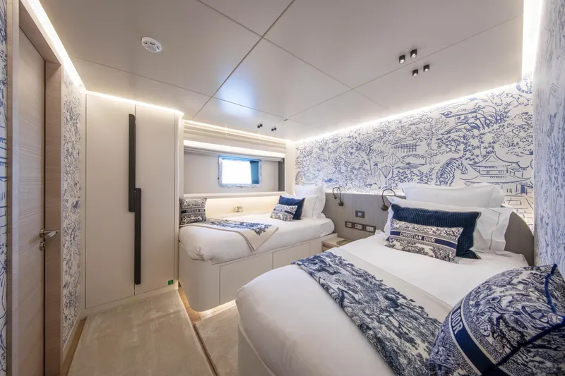 Oscar Yacht Photos Pics Luxurious 2023 Numarine 37XP yacht bedroom with elegant blue and white decor.