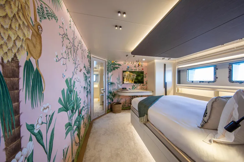 Oscar Yacht Photos Pics Luxurious 2023 Numarine 37XP yacht bedroom with tropical-themed decor and elegant furnishings.