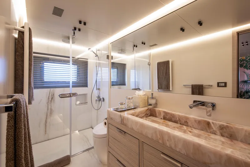 Oscar Yacht Photos Pics Luxurious bathroom in 2023 Numarine 37XP yacht, featuring marble sink and modern shower.