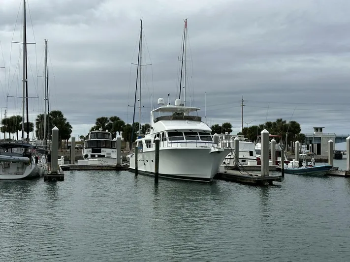  Yacht Photos Pics 2004 Cheoy Lee 72 yacht docked at marina with overcast sky.