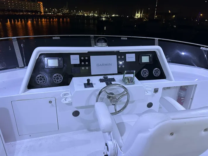  Yacht Photos Pics Cockpit of 2004 Cheoy Lee 72 yacht with Garmin navigation, night view.