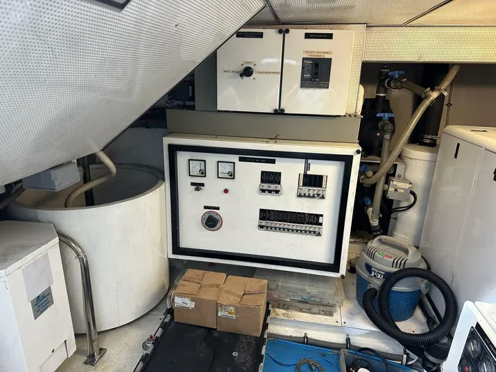  Yacht Photos Pics Engine room of 2004 Cheoy Lee 72 yacht with control panels and equipment.