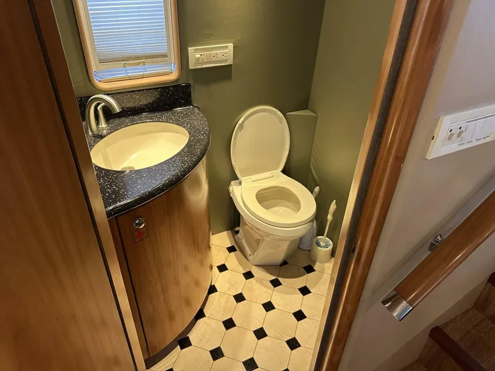  Yacht Photos Pics Bathroom interior of 2004 Cheoy Lee 72 yacht with sink and toilet.