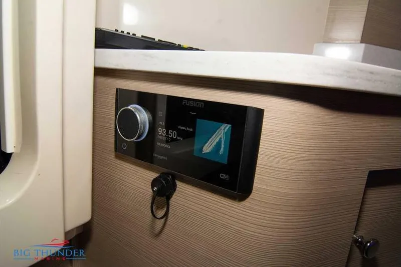  Yacht Photos Pics 2022 Scout 350 LXZ boat interior with Fusion stereo system display.