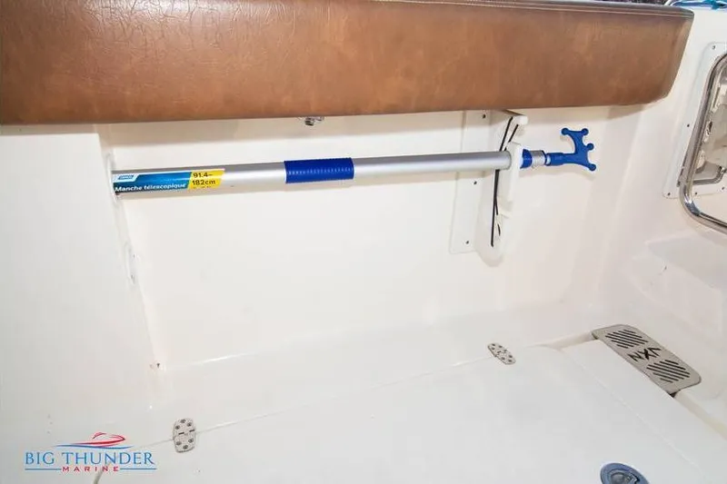  Yacht Photos Pics 2022 Scout 350 LXZ boat interior with mounted telescopic handle.