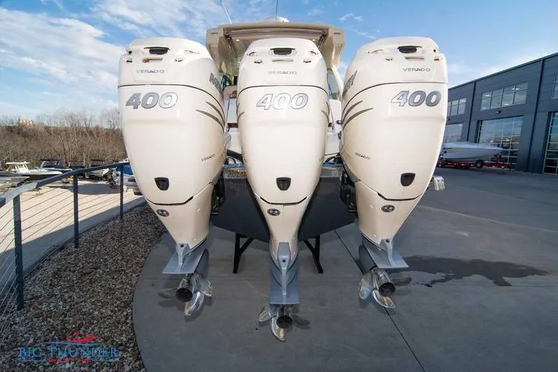  Yacht Photos Pics 2022 Scout 350 LXZ boat with triple 400 Verado engines at a marina.