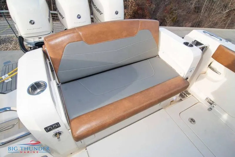  Yacht Photos Pics 2022 Scout 350 LXZ boat with brown and gray seating, featuring Mercury engines.