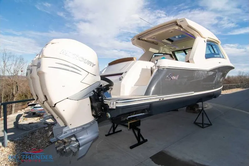  Yacht Photos Pics 2022 Scout 350 LXZ boat with Mercury outboard engines on display.