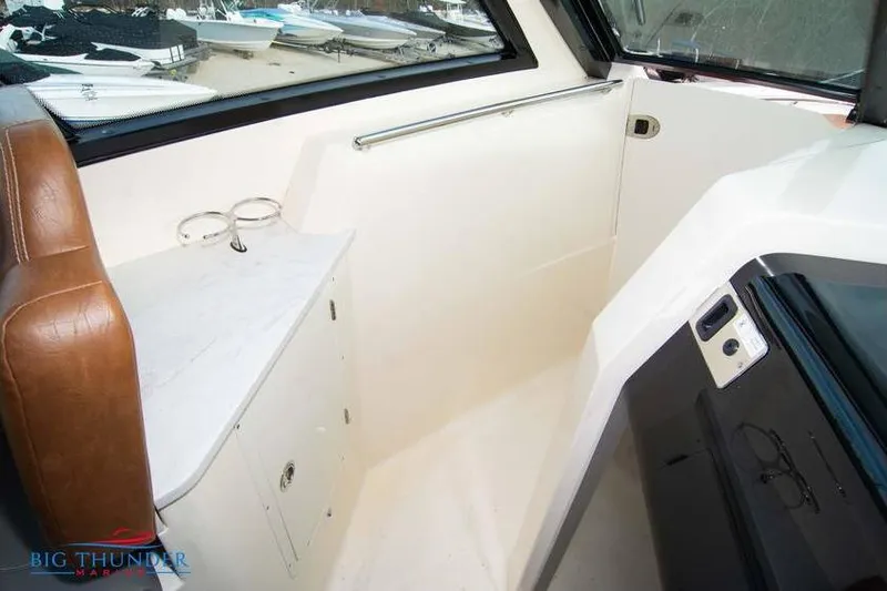  Yacht Photos Pics 2022 Scout 350 LXZ interior with leather seating and storage compartment.