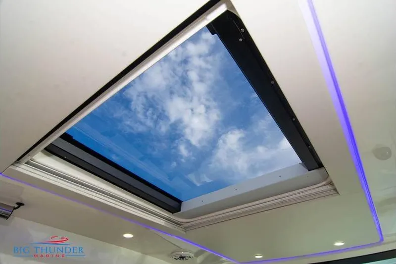  Yacht Photos Pics 2022 Scout 350 LXZ boat skylight with blue sky view.