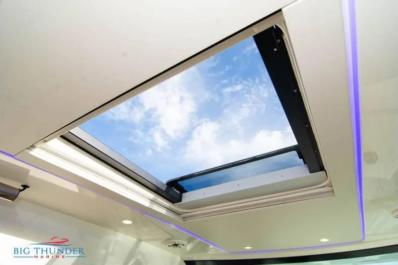  Yacht Photos Pics 2022 Scout 350 LXZ boat skylight with blue sky view.