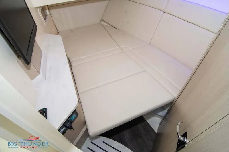  Yacht Photos Pics 2022 Scout 350 LXZ cabin interior with beige seating and modern amenities.
