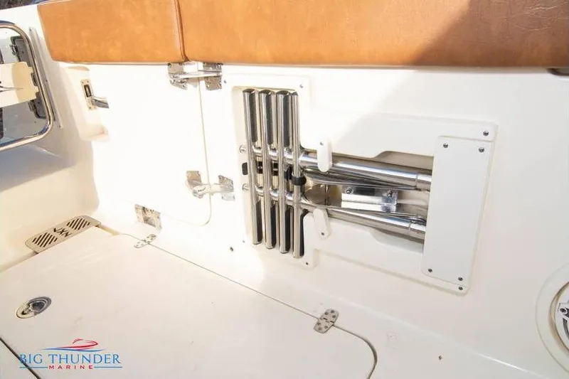  Yacht Photos Pics 2022 Scout 350 LXZ boat interior with rod holders and seating.