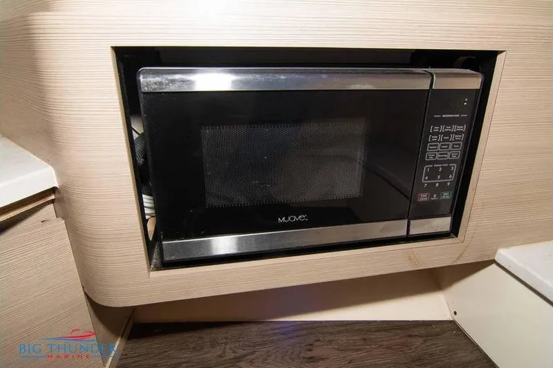  Yacht Photos Pics Built-in microwave in 2022 Scout 350 LXZ boat interior.