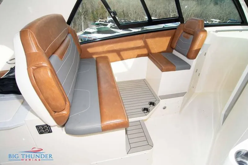  Yacht Photos Pics 2022 Scout 350 LXZ boat interior with brown and gray seating, large windows.