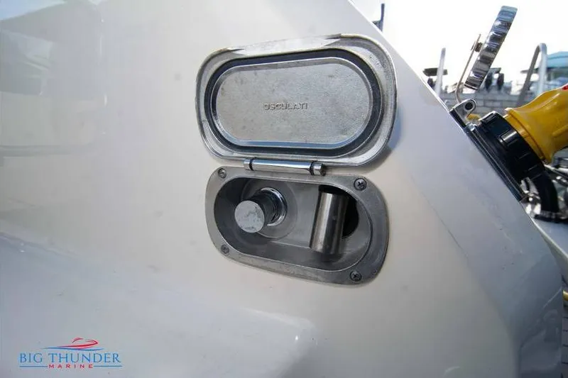  Yacht Photos Pics Fuel cap of 2022 Scout 350 LXZ boat, featuring a metallic cover and marine branding.