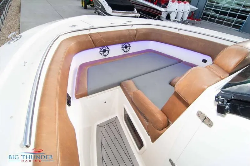  Yacht Photos Pics 2022 Scout 350 LXZ boat interior with tan seating and LED lighting.