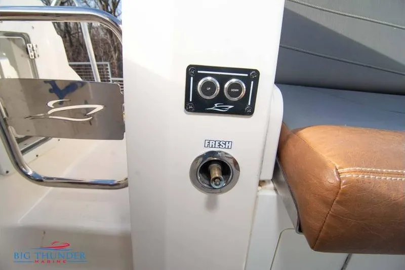  Yacht Photos Pics 2022 Scout 350 LXZ boat interior with control panel and leather seating.