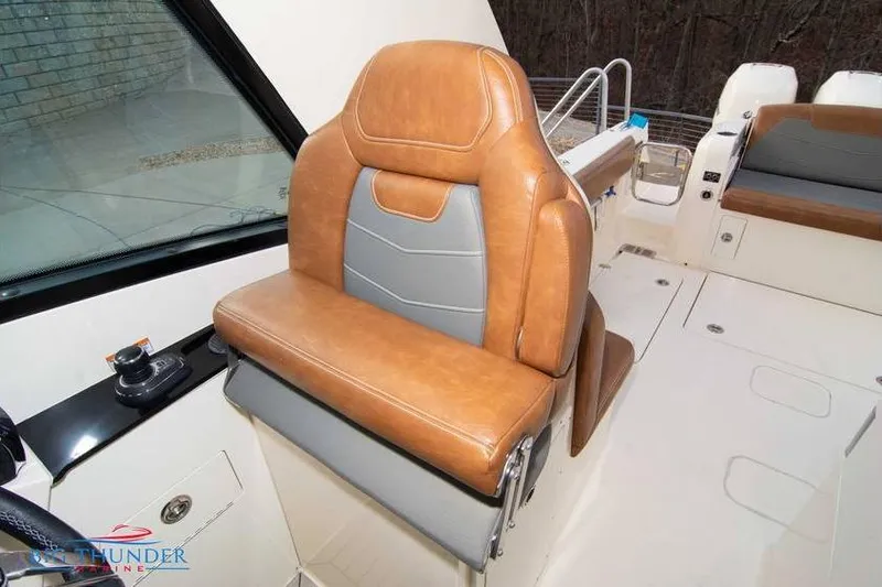  Yacht Photos Pics 2022 Scout 350 LXZ boat with luxurious tan and gray seating.