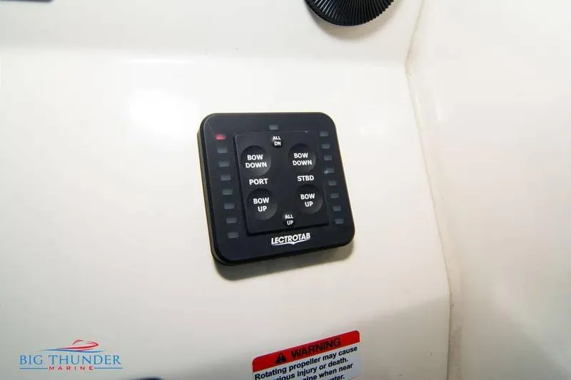  Yacht Photos Pics Control panel of 2022 Scout 350 LXZ boat with Lectrotab trim tab switches.