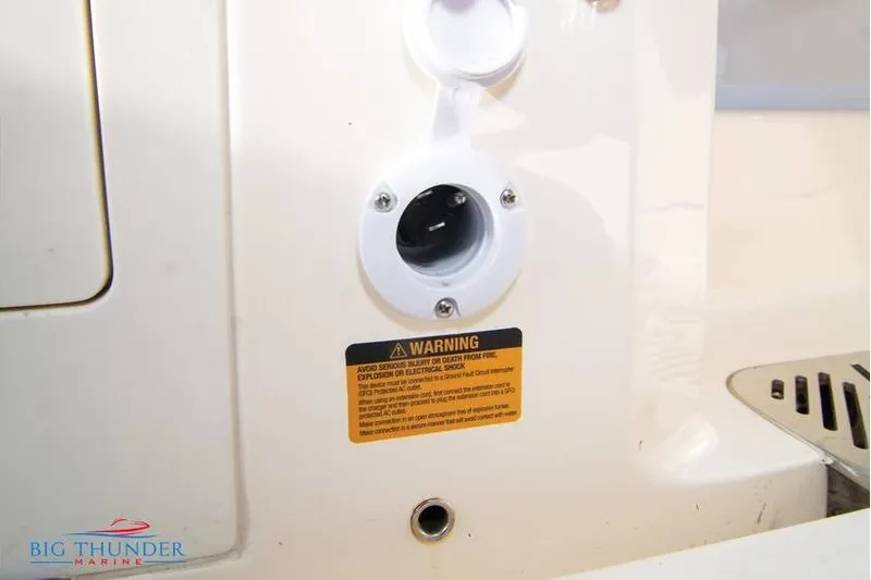  Yacht Photos Pics 2022 Scout 350 LXZ boat warning label and electrical outlet detail.