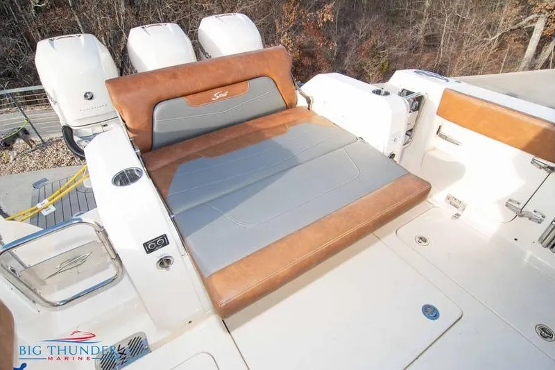  Yacht Photos Pics 2022 Scout 350 LXZ boat with luxurious seating and triple outboard engines.