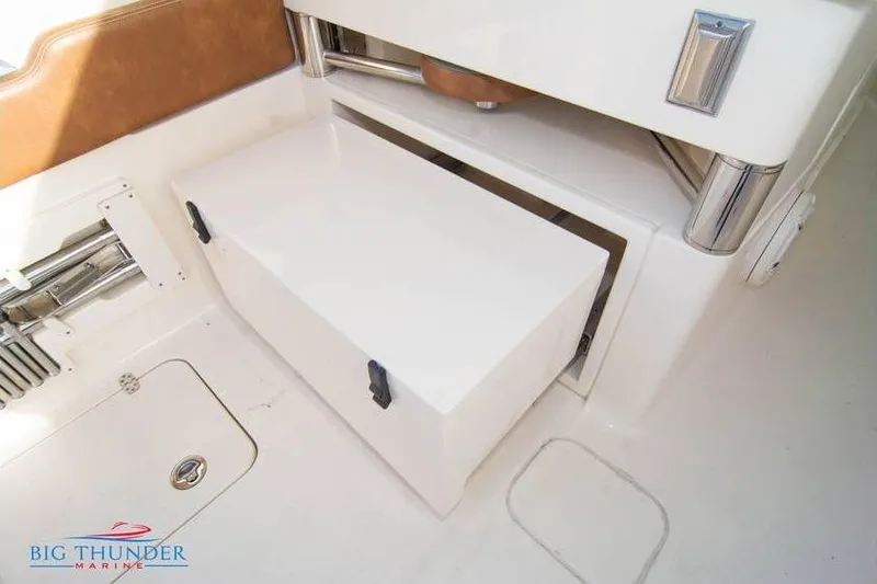  Yacht Photos Pics 2022 Scout 350 LXZ boat interior storage compartment with sleek design and secure latches.