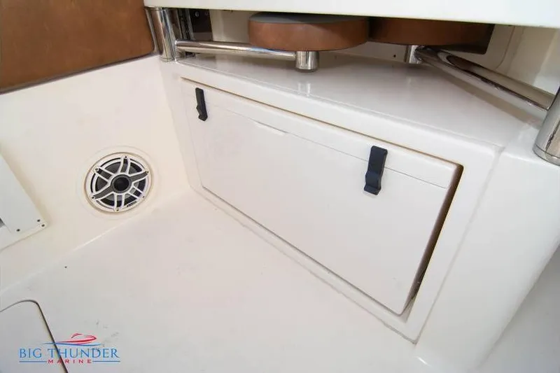  Yacht Photos Pics 2022 Scout 350 LXZ boat interior with storage compartment and speaker.