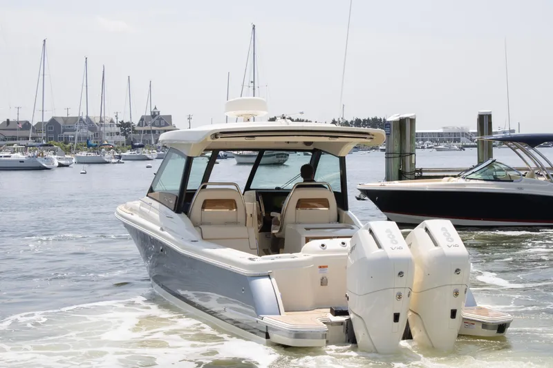  Yacht Photos Pics 2025 Chris-Craft Calypso 32 boat docked in a marina with twin engines.