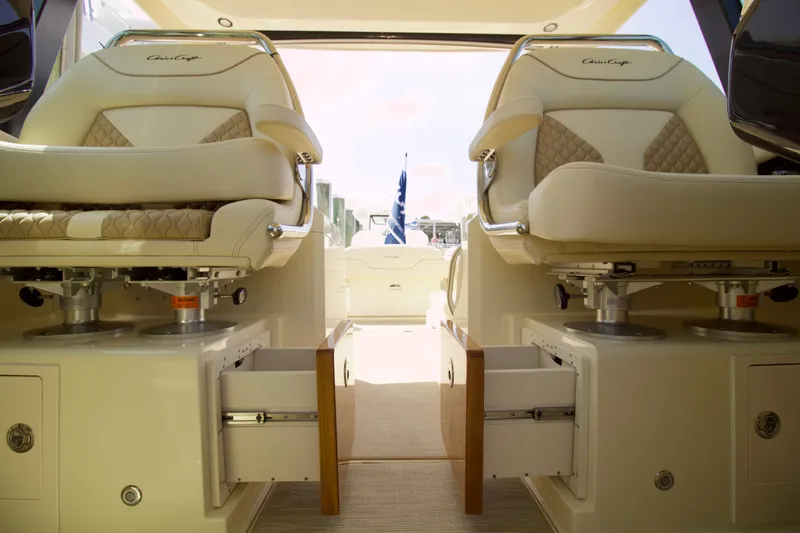  Yacht Photos Pics 2025 Chris-Craft Calypso 32 interior with luxurious seating and storage drawers.