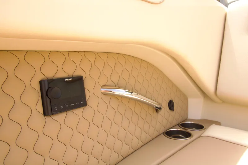  Yacht Photos Pics Luxurious interior of 2025 Chris-Craft Calypso 32 with Fusion audio system and cup holders.