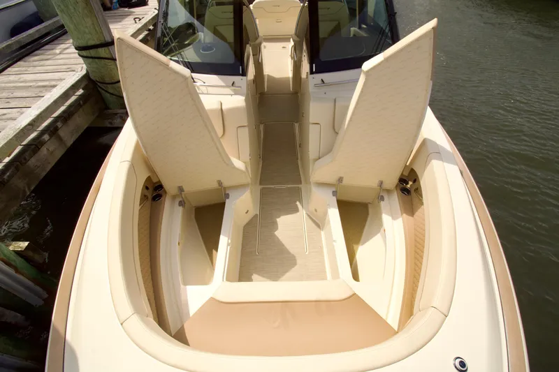  Yacht Photos Pics 2025 Chris-Craft Calypso 32 boat interior with open storage compartments at dock.