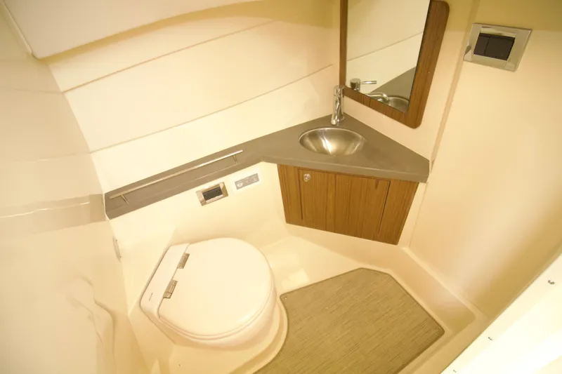  Yacht Photos Pics 2025 Chris-Craft Calypso 32 boat bathroom with modern sink and toilet.