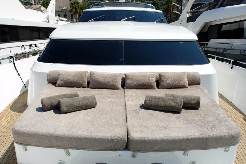  Yacht Photos Pics Sunbathing area on the 2006 Sanlorenzo SL88 yacht with cushioned loungers.