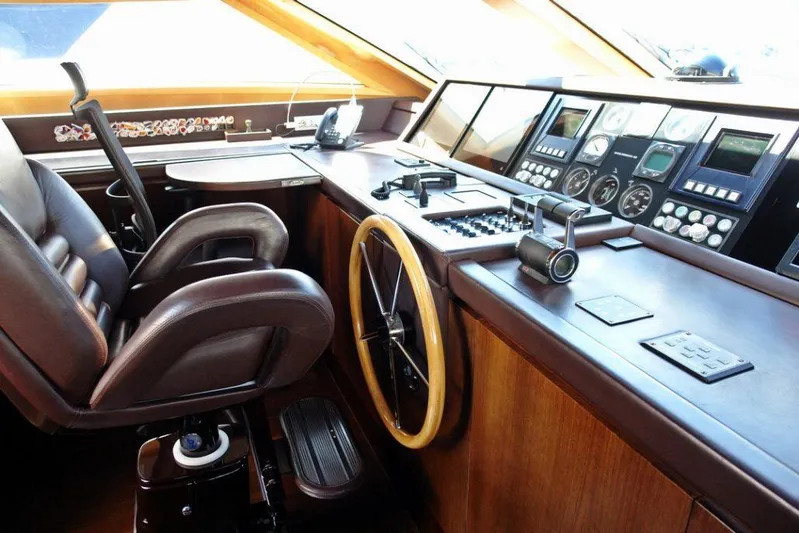  Yacht Photos Pics Helm station of 2006 Sanlorenzo SL88 yacht with leather captain's chair and advanced navigation controls.