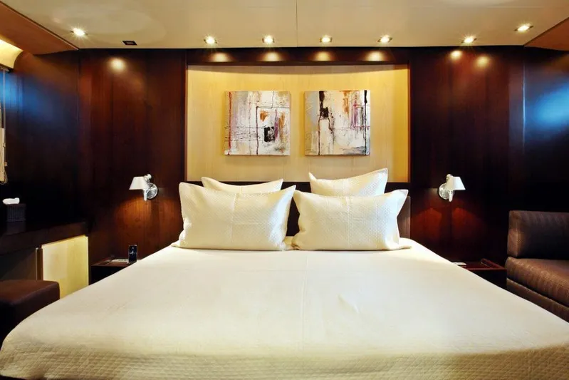  Yacht Photos Pics Luxurious bedroom on 2006 Sanlorenzo SL88 yacht with modern decor and ambient lighting.