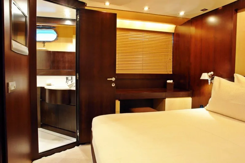  Yacht Photos Pics Luxurious bedroom interior of 2006 Sanlorenzo SL88 yacht with ensuite bathroom.
