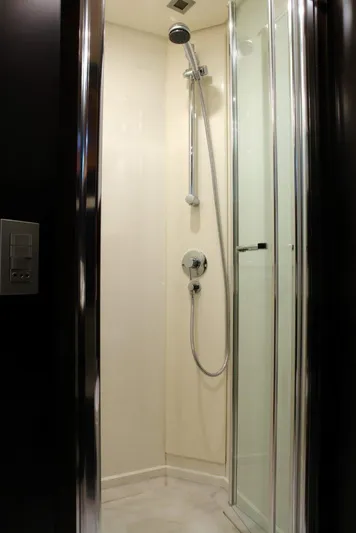  Yacht Photos Pics Modern shower in 2006 Sanlorenzo SL88 yacht with glass door and chrome fixtures.