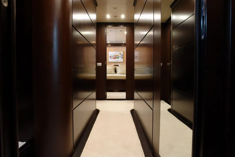  Yacht Photos Pics Luxurious hallway inside 2006 Sanlorenzo SL88 yacht with dark wood paneling.