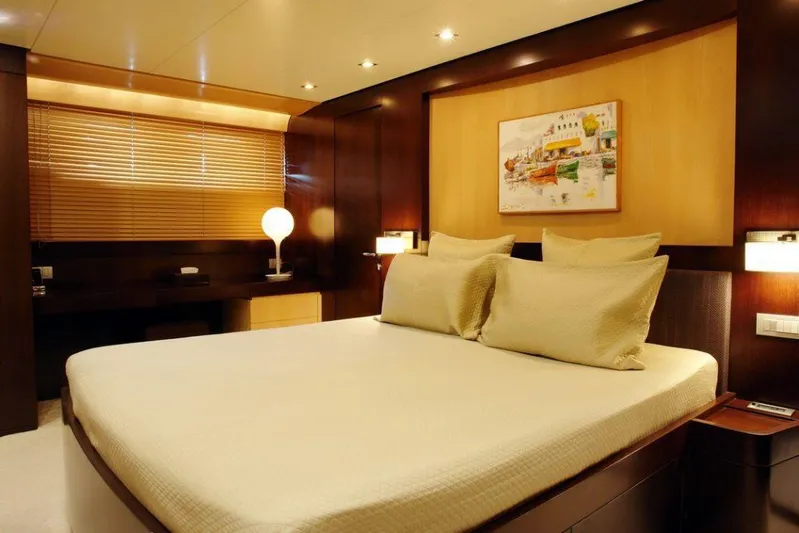  Yacht Photos Pics Luxurious bedroom on 2006 Sanlorenzo SL88 yacht with modern decor and ambient lighting.