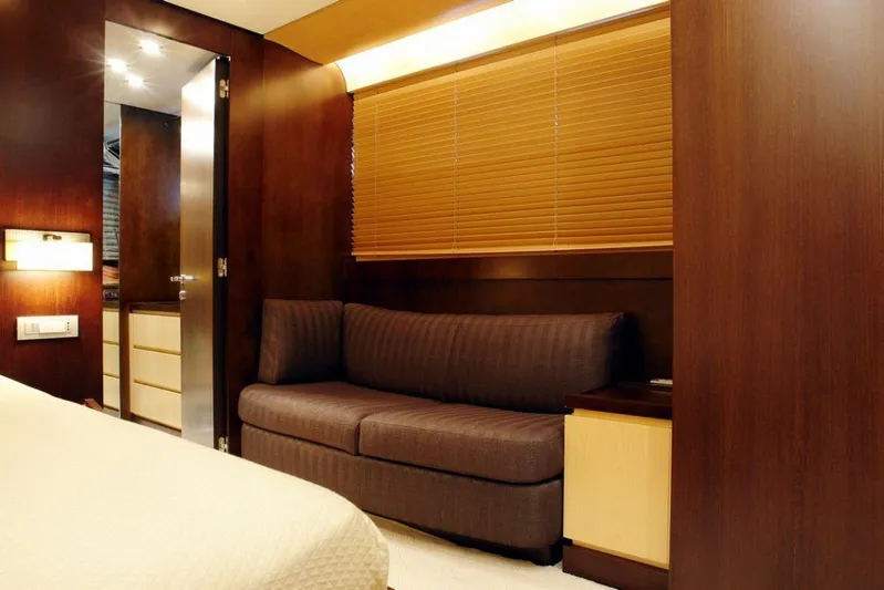  Yacht Photos Pics Luxurious interior of 2006 Sanlorenzo SL88 yacht with wooden finishes and cozy seating.