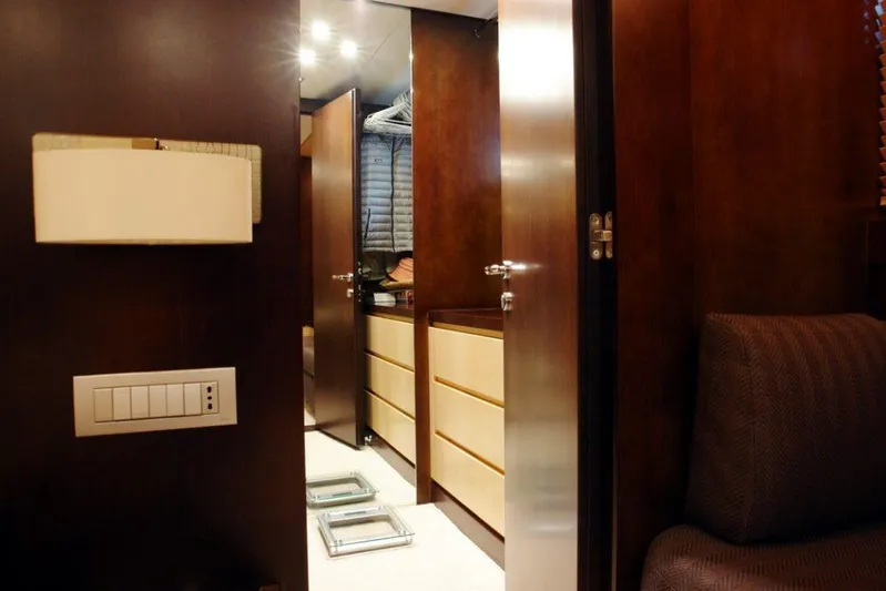  Yacht Photos Pics Interior of 2006 Sanlorenzo SL88 yacht with wooden cabinetry and modern lighting.