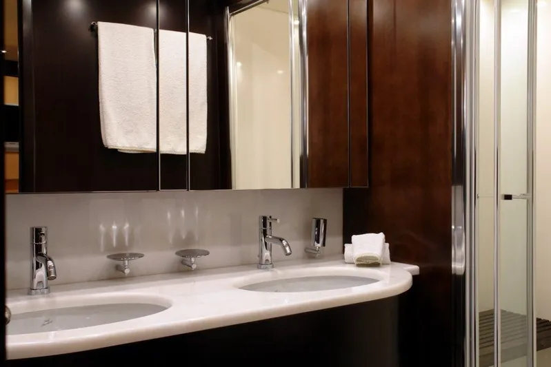  Yacht Photos Pics Luxurious bathroom in 2006 Sanlorenzo SL88 yacht with double sinks and modern fixtures.