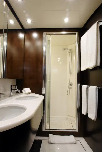  Yacht Photos Pics Luxurious bathroom on a 2006 Sanlorenzo SL88 yacht with modern fixtures.