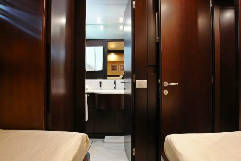  Yacht Photos Pics Interior of 2006 Sanlorenzo SL88 yacht showing bathroom and twin beds.