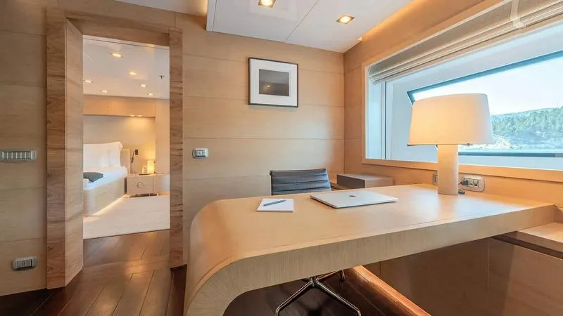  Yacht Photos Pics Luxurious interior of 2008 Ortona Navi ZIA yacht with elegant desk and window view.