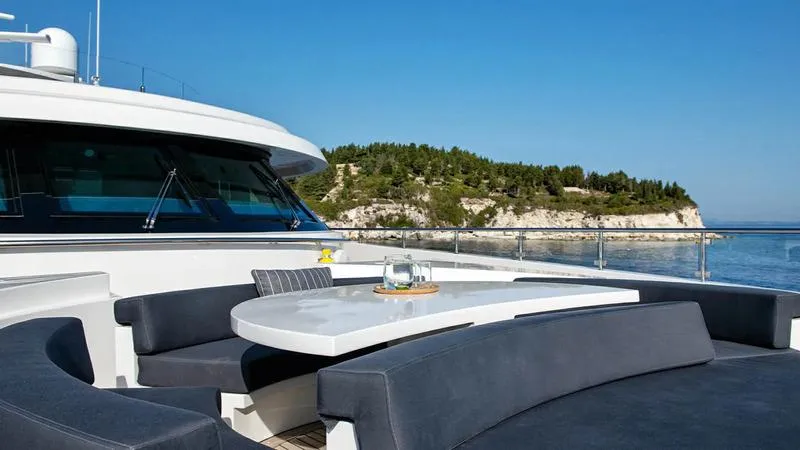  Yacht Photos Pics Luxurious Ortona Navi ZIA yacht deck with elegant seating, ocean view, and coastal backdrop.