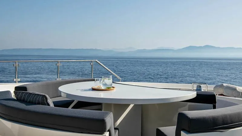  Yacht Photos Pics Luxurious Ortona Navi ZIA yacht deck with ocean view, featuring a round table and seating, 2008 model.