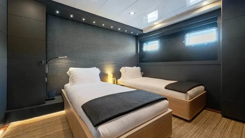  Yacht Photos Pics Luxurious twin bedroom on Ortona Navi ZIA yacht, 2008 model, featuring modern design and ambient lighting.